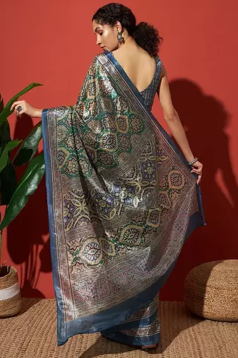 Green printed tissue festive wear saree with blouse piece
