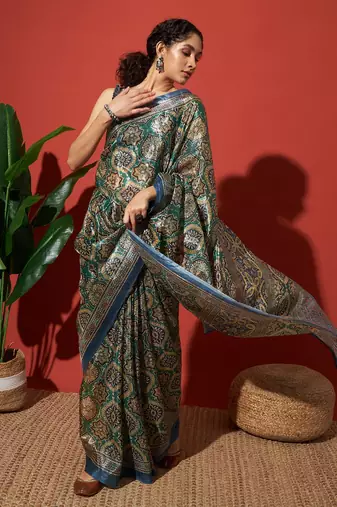 Green printed tissue festive wear saree with blouse piece