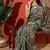 Green printed tissue festive wear saree with blouse piece