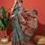 Turquoise blue printed tissue festive wear saree with blouse piece
