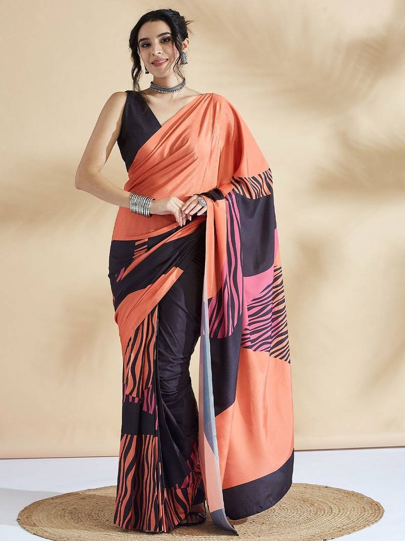 Orange printed crepe casual saree with blouse piece
