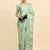 Green printed silk blend ethnic saree with blouse piece