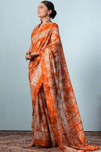 Orange printed silk blend ethnic saree with blouse piece