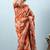 Orange printed silk blend ethnic saree with blouse piece