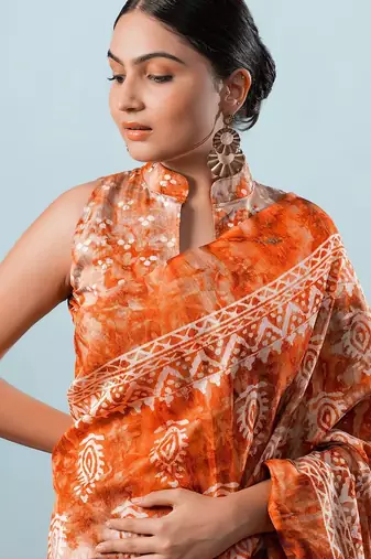 Orange printed silk blend ethnic saree with blouse piece