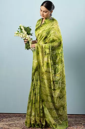 Green printed silk blend ethnic saree with blouse piece