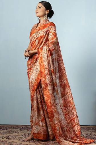 Orange printed silk blend ethnic saree with blouse piece
