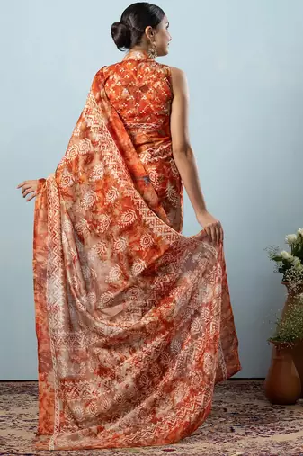 Orange printed silk blend ethnic saree with blouse piece