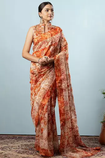 Orange printed silk blend ethnic saree with blouse piece