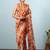 Orange printed silk blend ethnic saree with blouse piece