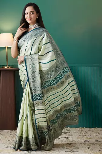 Green printed brasso casual saree with blouse piece