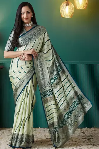 Green printed brasso casual saree with blouse piece