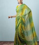 Green elegant printed georgette saree with blouse piece