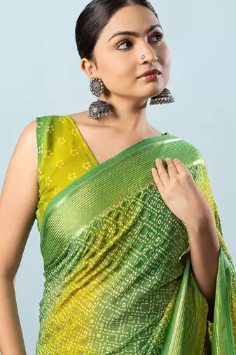 Green elegant printed georgette saree with blouse piece