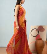 Red elegant printed georgette saree with blouse piece