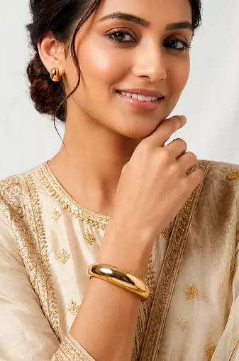 Gold metallic hinged bangle