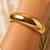 Gold metallic hinged bangle