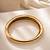 Gold metallic hinged bangle