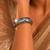 Silver metallic hinged cuff bangle