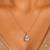 Gold plated white stone pendant necklace