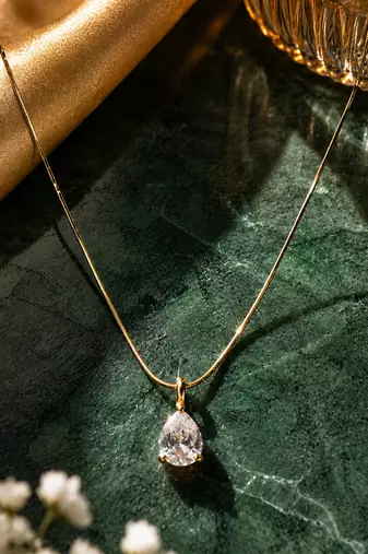 Gold plated white stone pendant necklace