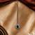 Silver plated green treardrop stone maang tikka