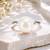 Silver metallic opal white pearl adjustable ring