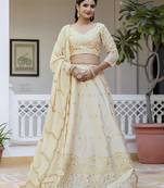 Beige embroidered lehenga choli with dupatta