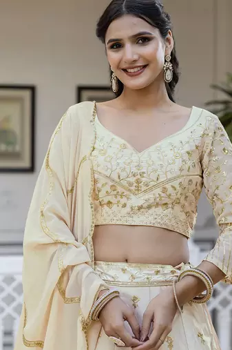 Beige embroidered lehenga choli with dupatta
