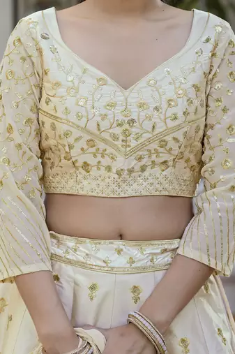 Beige embroidered lehenga choli with dupatta