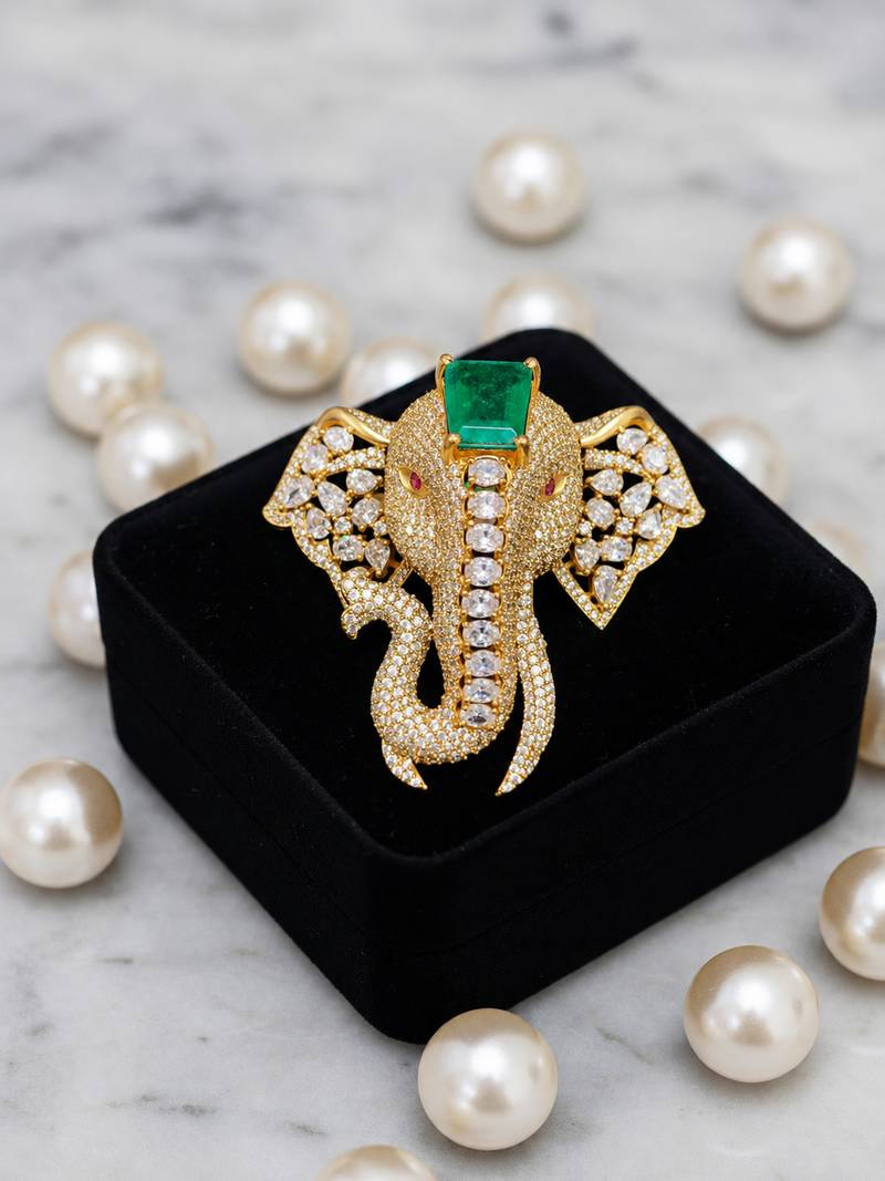 Royal elephant designer brooch with green emerald-cut crystal & american diamond stones | gold-plated statement brooch