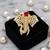 Royal elephant designer brooch with red emerald-cut crystal & american diamond stones | gold-plated statement brooch
