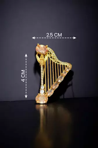 Elegant harp design crystal brooch with peach champagne stones | gold-plated musical instrument brooch pin