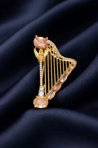 Elegant harp design crystal brooch with peach champagne stones | gold-plated musical instrument brooch pin