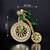 Designer bicycle brooch with emerald green crystal stones & american diamonds | gold-plated vintage cycle brooch pin