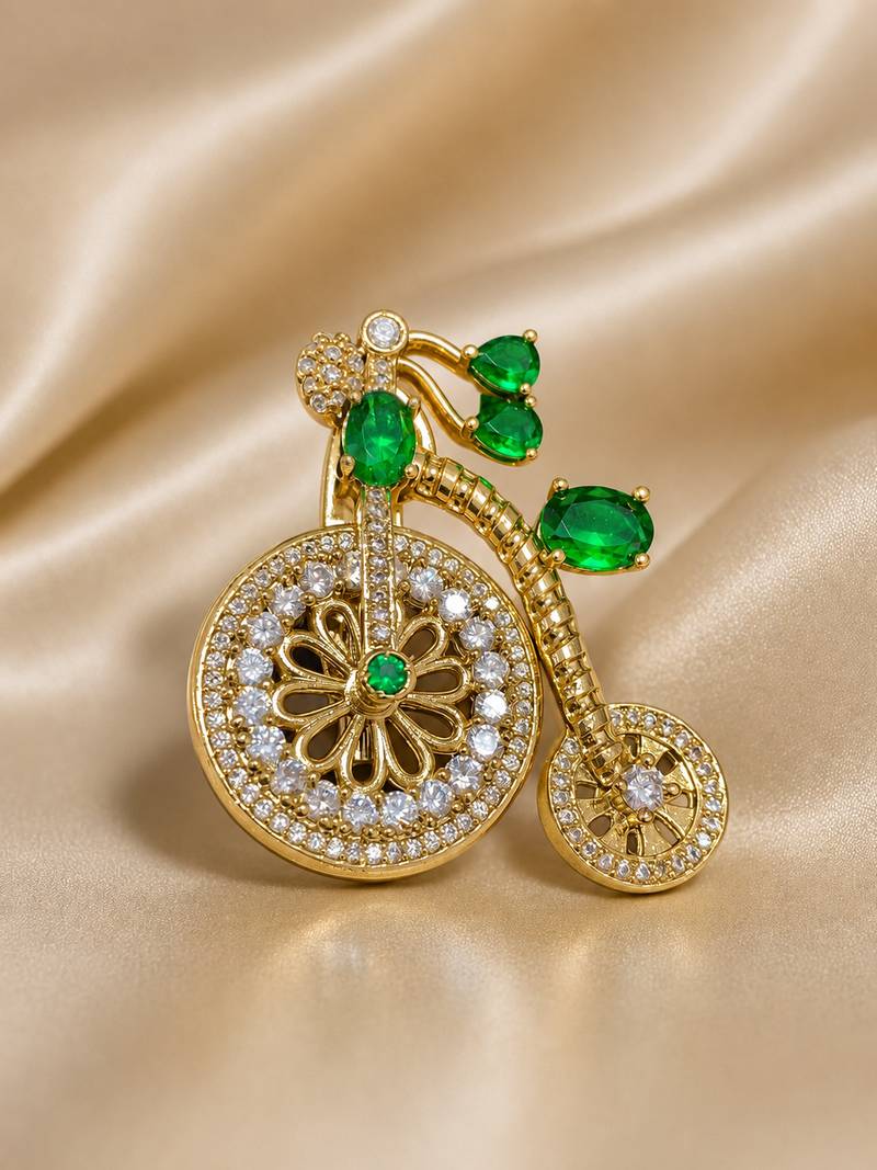 Designer bicycle brooch with emerald green crystal stones & american diamonds | gold-plated vintage cycle brooch pin