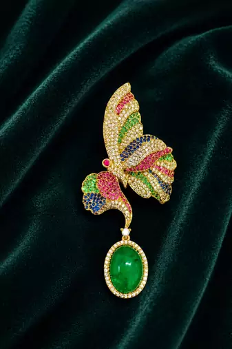 Designer multicolor butterfly brooch with green oval stone & american diamond embellishments