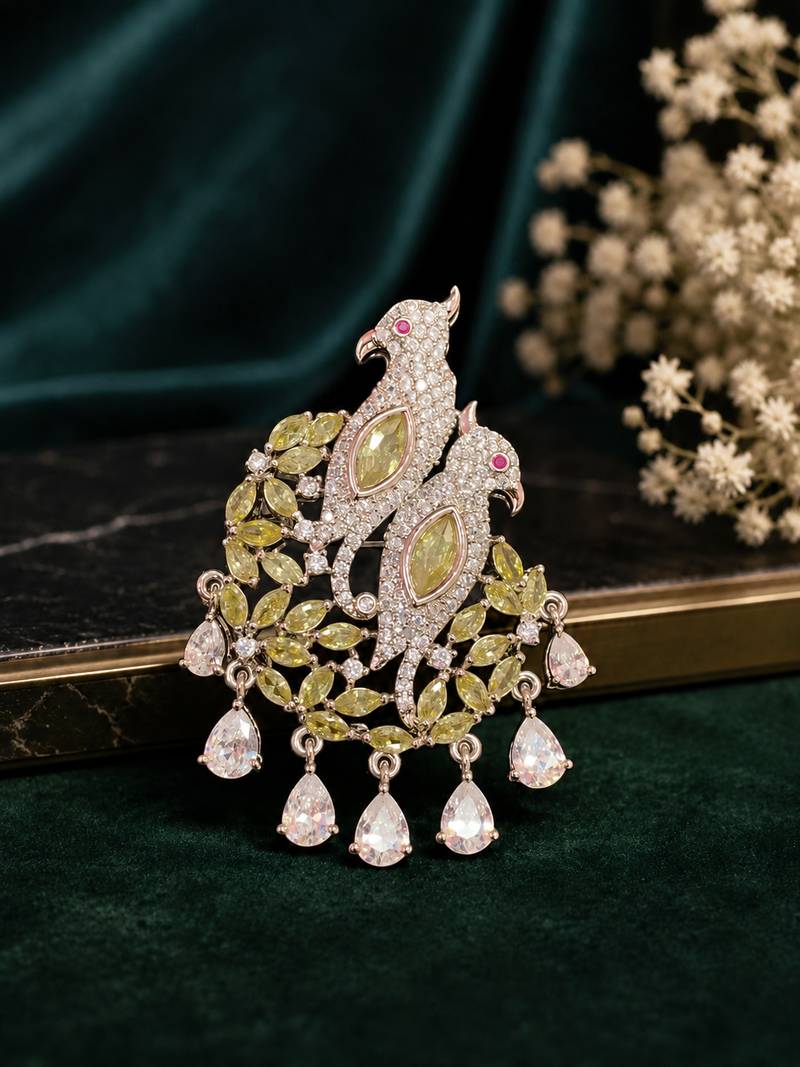 Elegant twin parrot designer brooch with yellow crystal leaves & dangling teardrop stones | brooch
