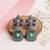 Silver plated green stone dangler earrings