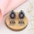 Silver plated blue stone kundan dangler earrings