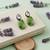 Silver plated green stone drop earrings