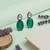 Silver plated green stone drop earrings