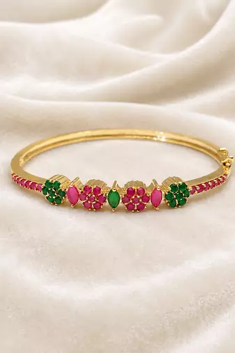 Gold-plated floral kada bracelet with ruby & emerald stones openable free size 
