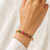 Gold-plated floral kada bracelet with ruby & emerald stones openable free size 