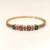 Gold-plated floral kada bracelet with ruby & emerald stones openable free size 