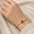 Gold-toned kada bangle with blue oval stone and pearl accents openable free size 