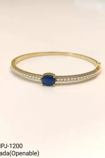 Gold-toned kada bangle with blue oval stone and pearl accents openable free size 