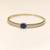 Gold-toned kada bangle with blue oval stone and pearl accents openable free size 