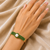 Gold-plated kada bracelet with pearl & green stone openable free size 