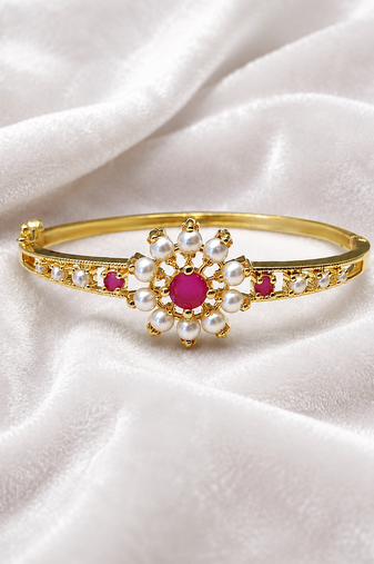 Gold-plated floral bangle with ruby and pearl stones openable free size 